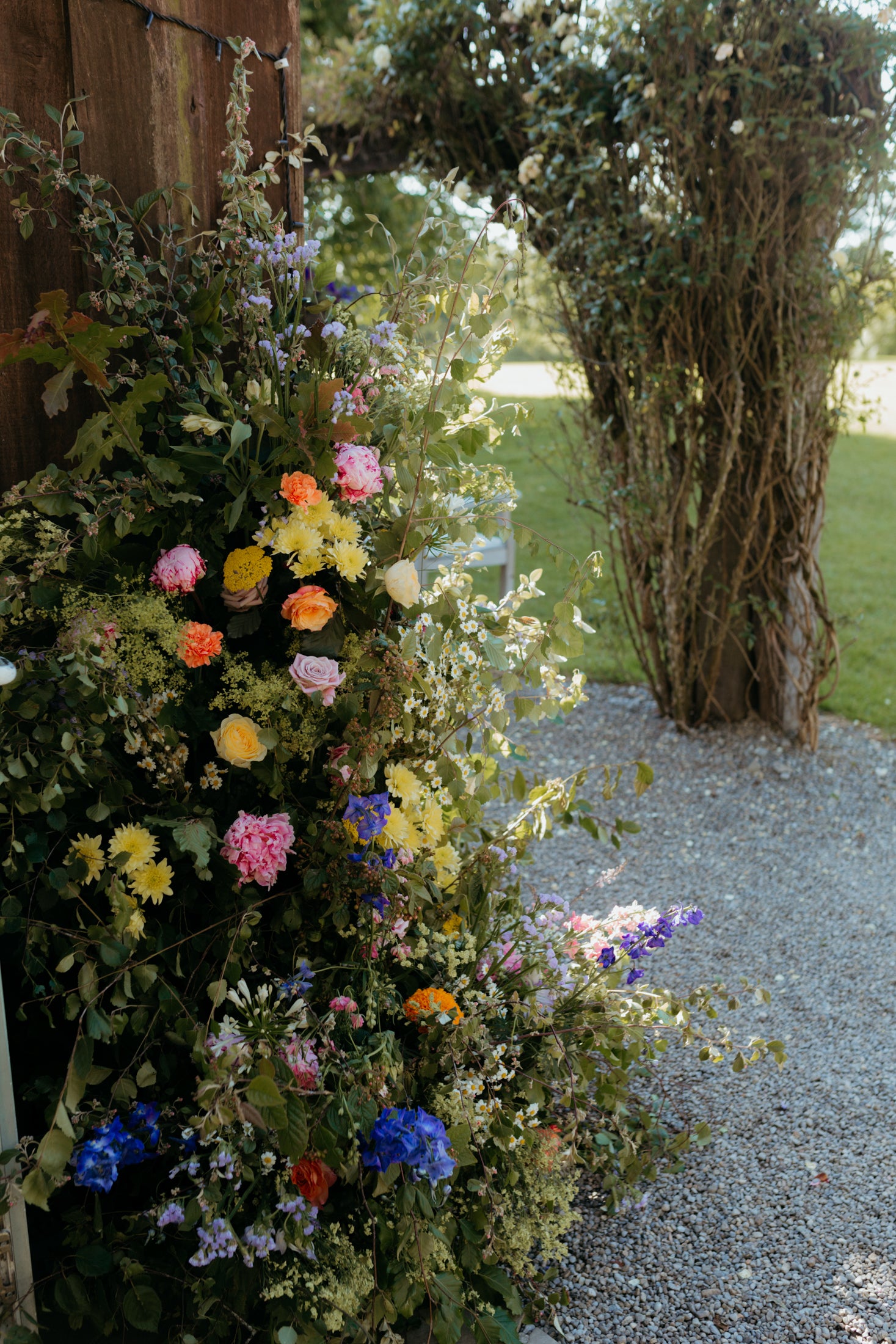 Wedding flower arch in Summer colours by Flowers on Four Acres -Folklore Photography